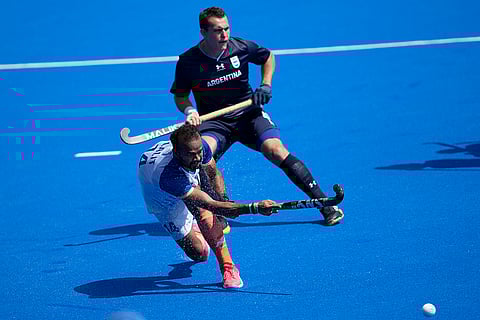 Lalit Kumar Upadhyay passes the ball duing the match against Argentina